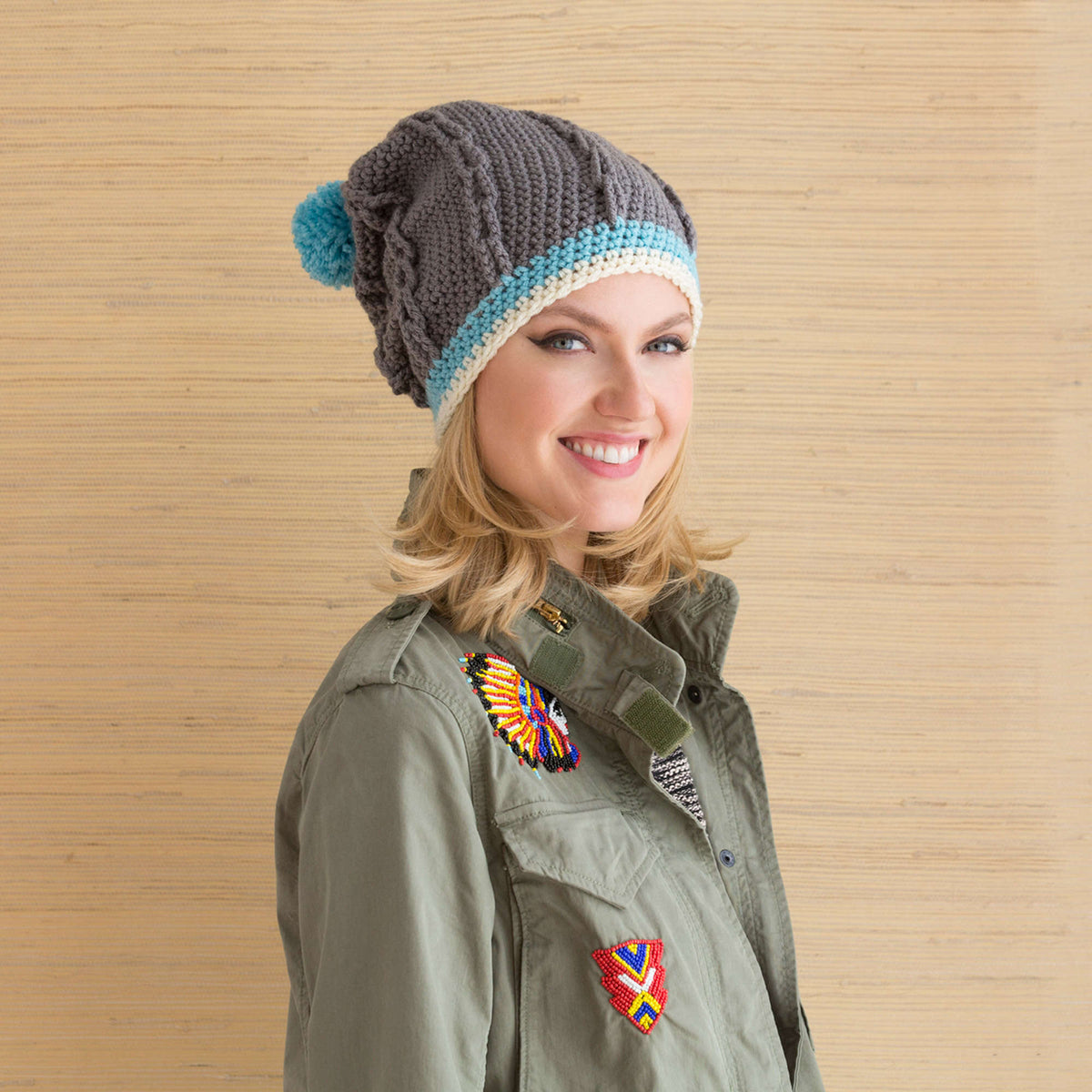 Red Heart Cabled Hat with Pompom Pattern | cables, Hats, Women